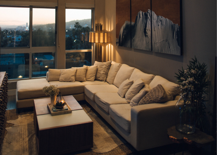 Large corner sofa with ambient dim lighting